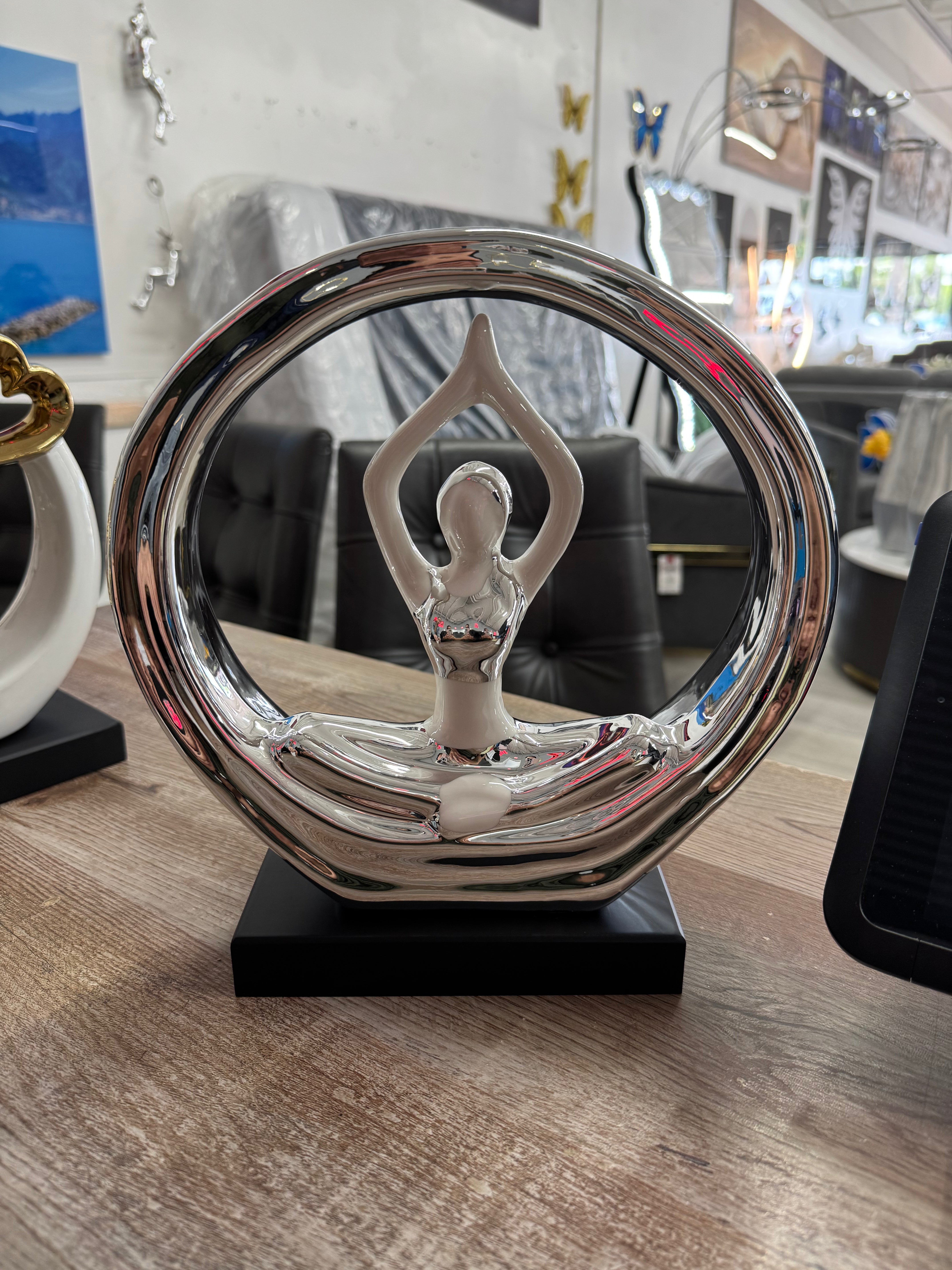 SILVER CHROME AND WHITE CERAMIC YOGA LADY SCULPTURE WITH A BLACK BASE
