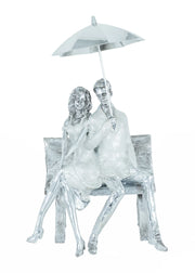 COUPLE ON BENCH WITH UMBRELLA SCULPTURE