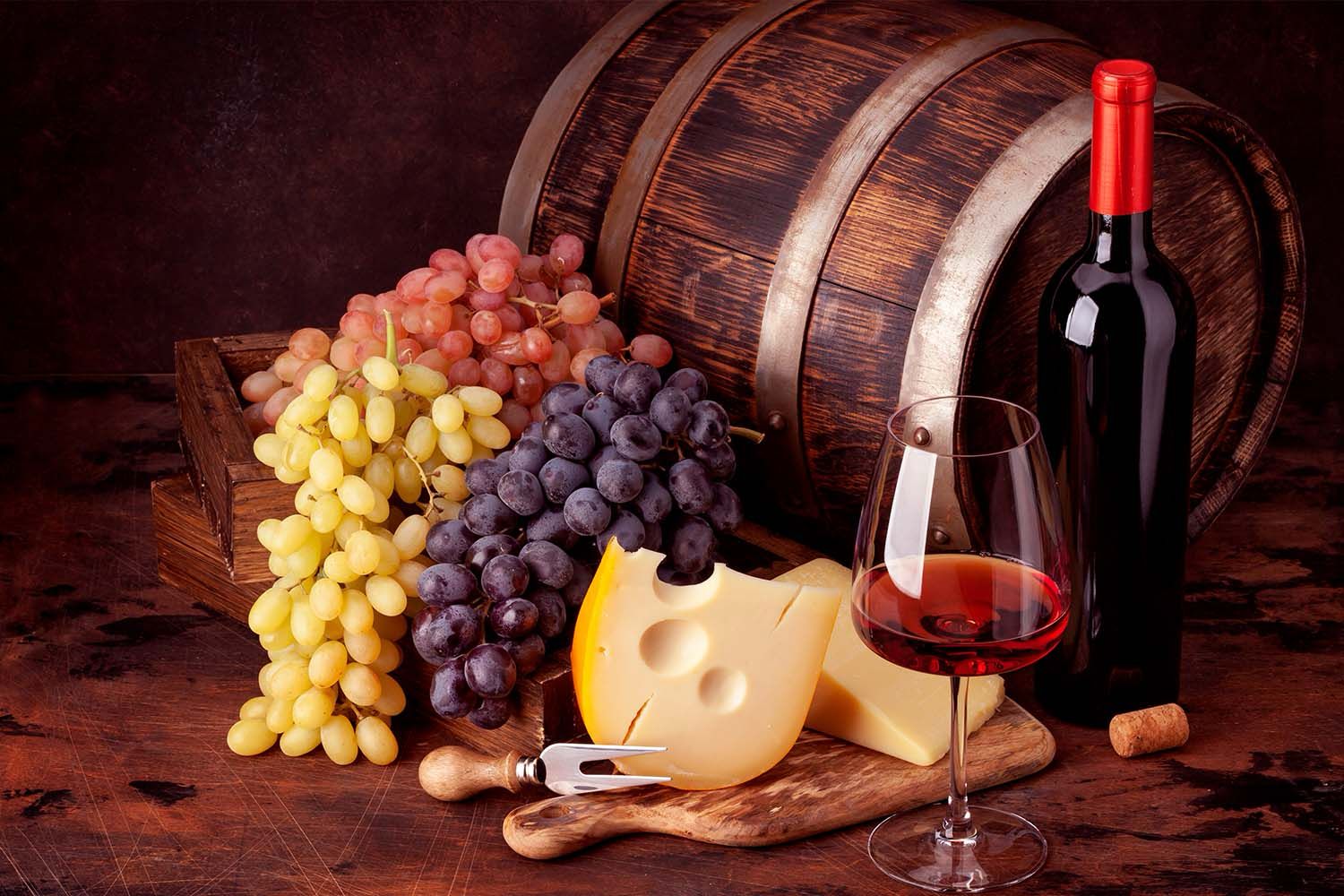 WINE BOTTLE, GRAPES, CHEESE AND GLASS